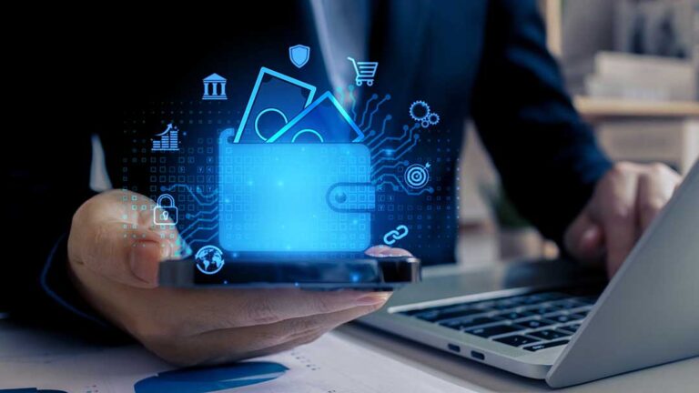 A middle-aged couple reviews investment documents together at a dining table with a laptop and calculator.